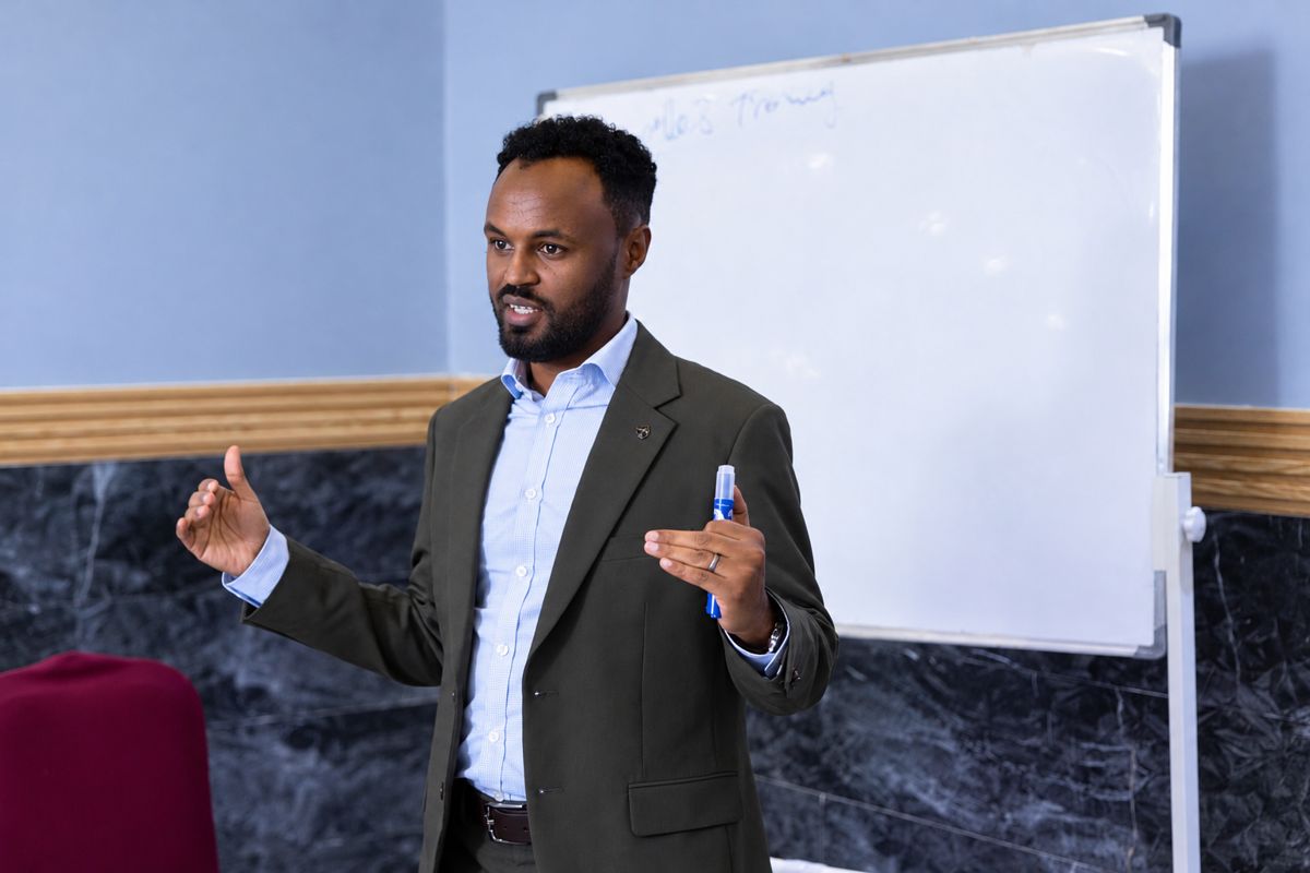 Jama Dafac speaking at a training session